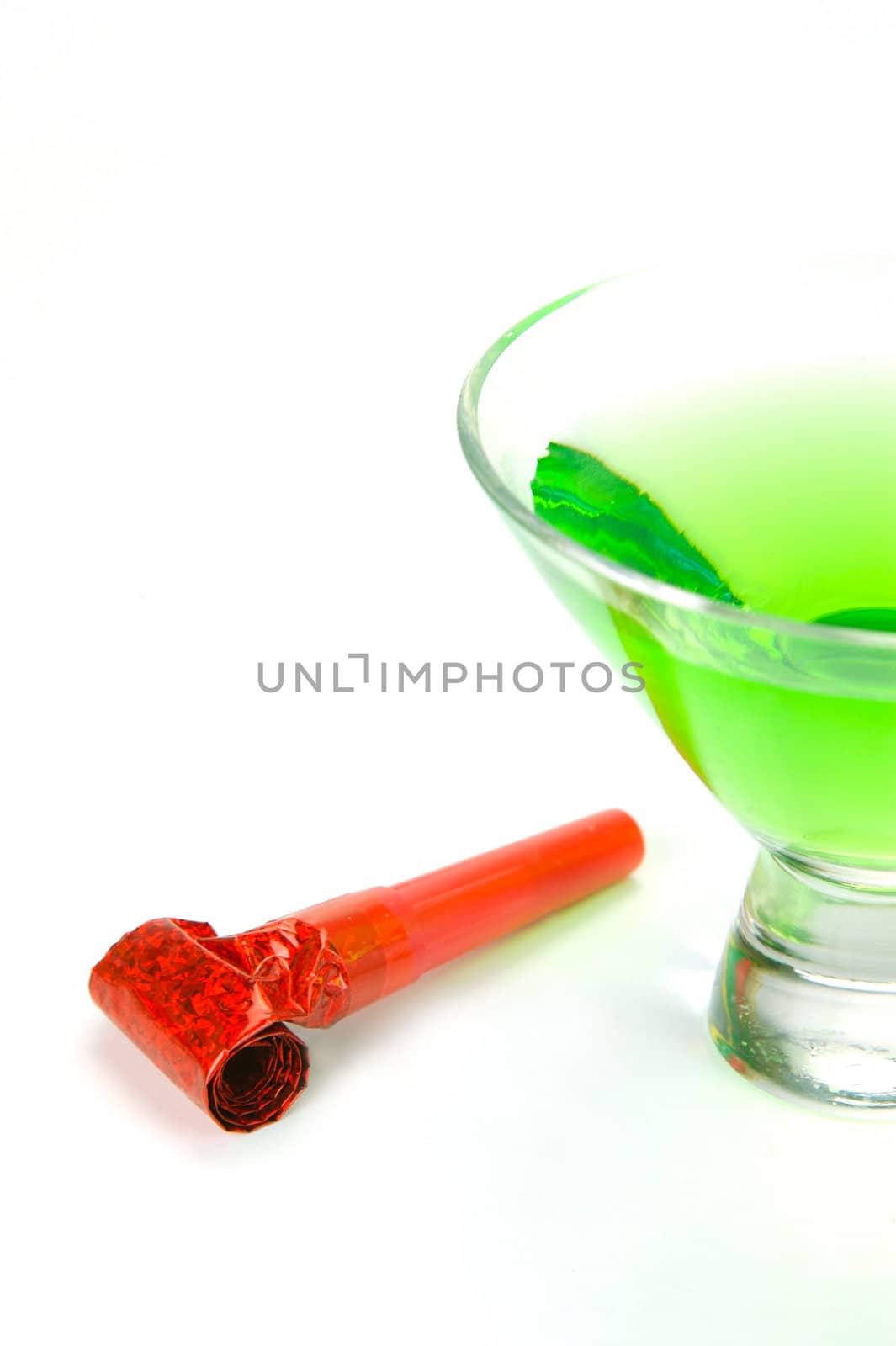 Cosmopolitan cocktails and party favours isolated against a white background
