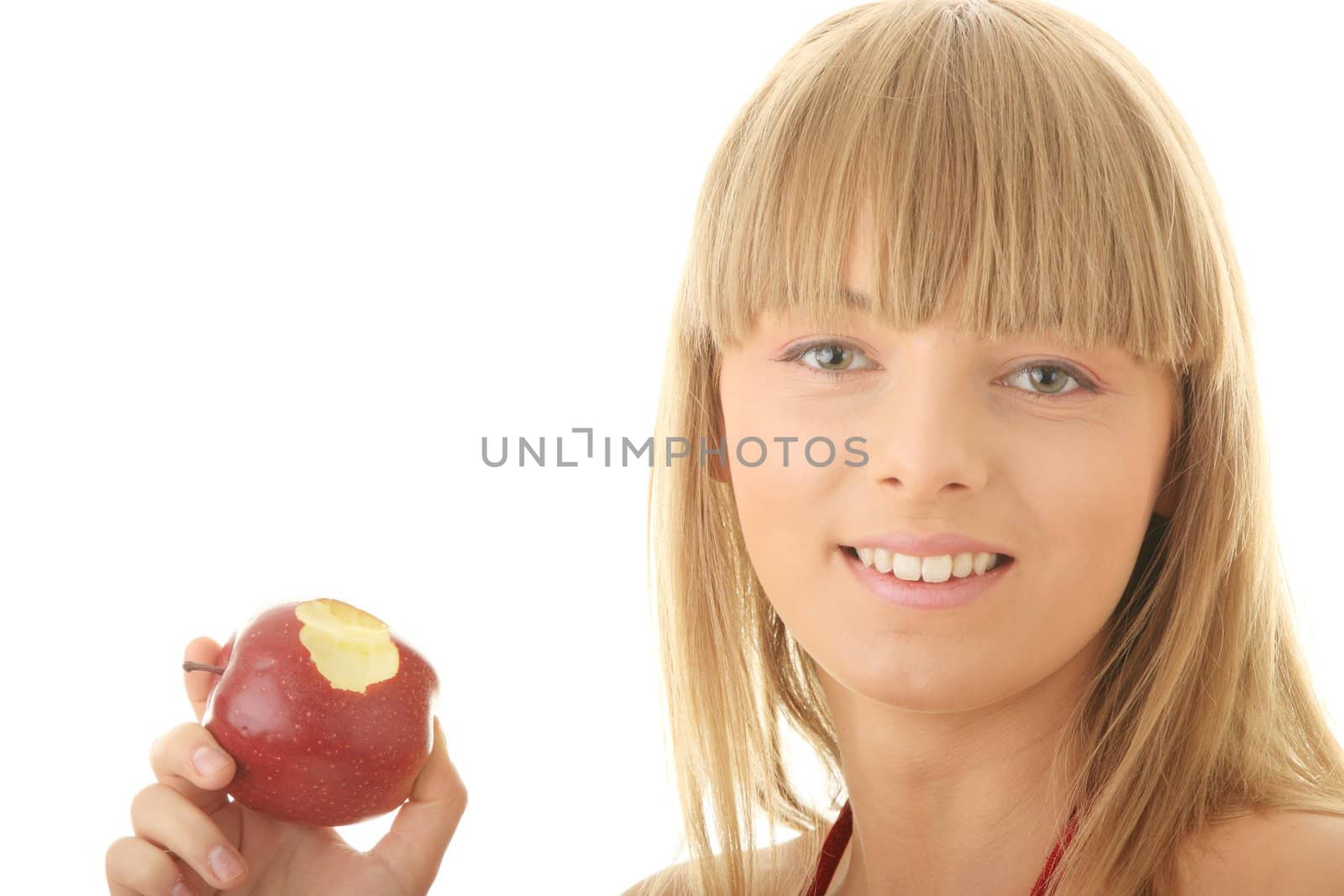 Young blond woman with red apple isolated on white background - healthy concept