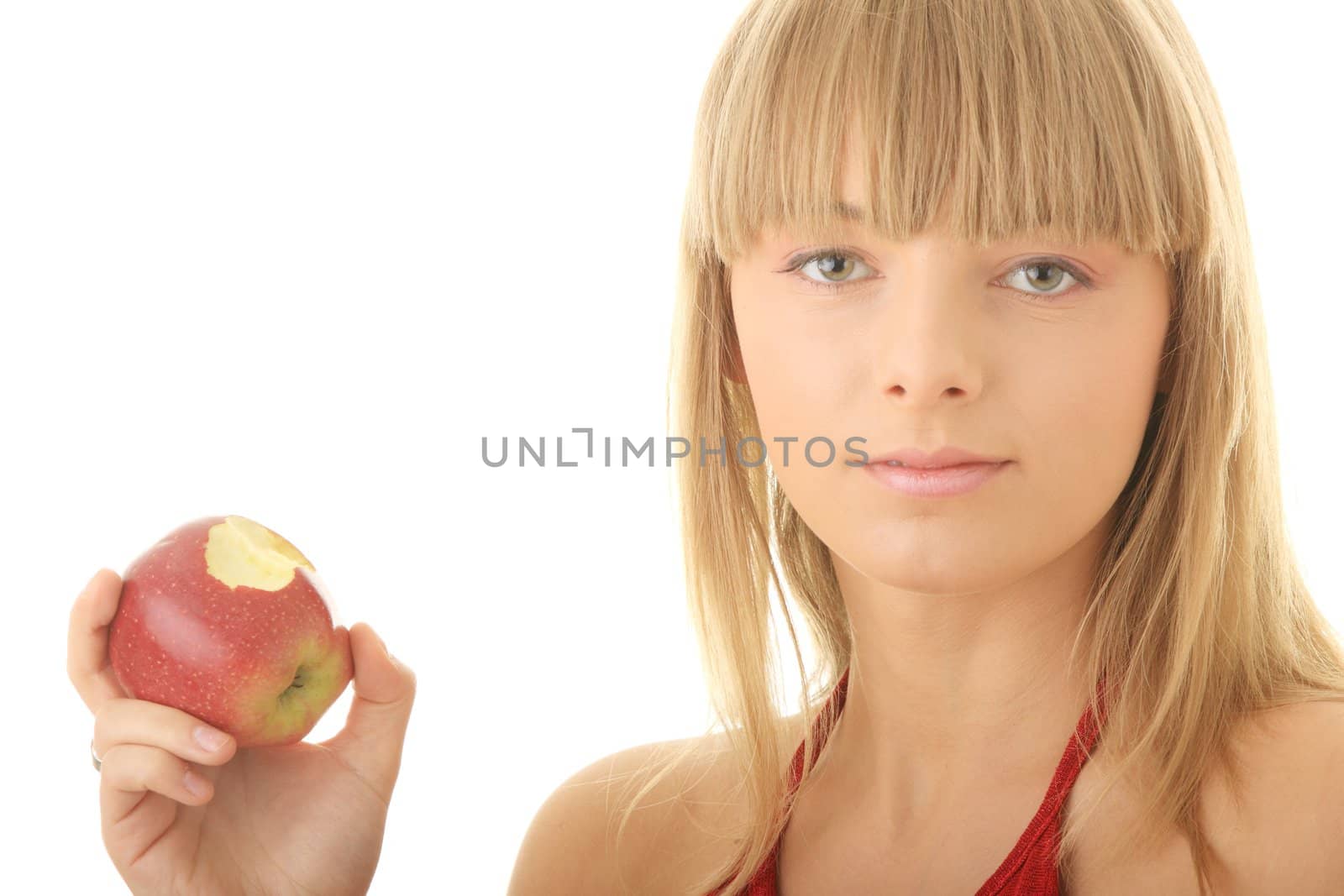 Young blond woman with red apple isolated on white background - healthy concept
