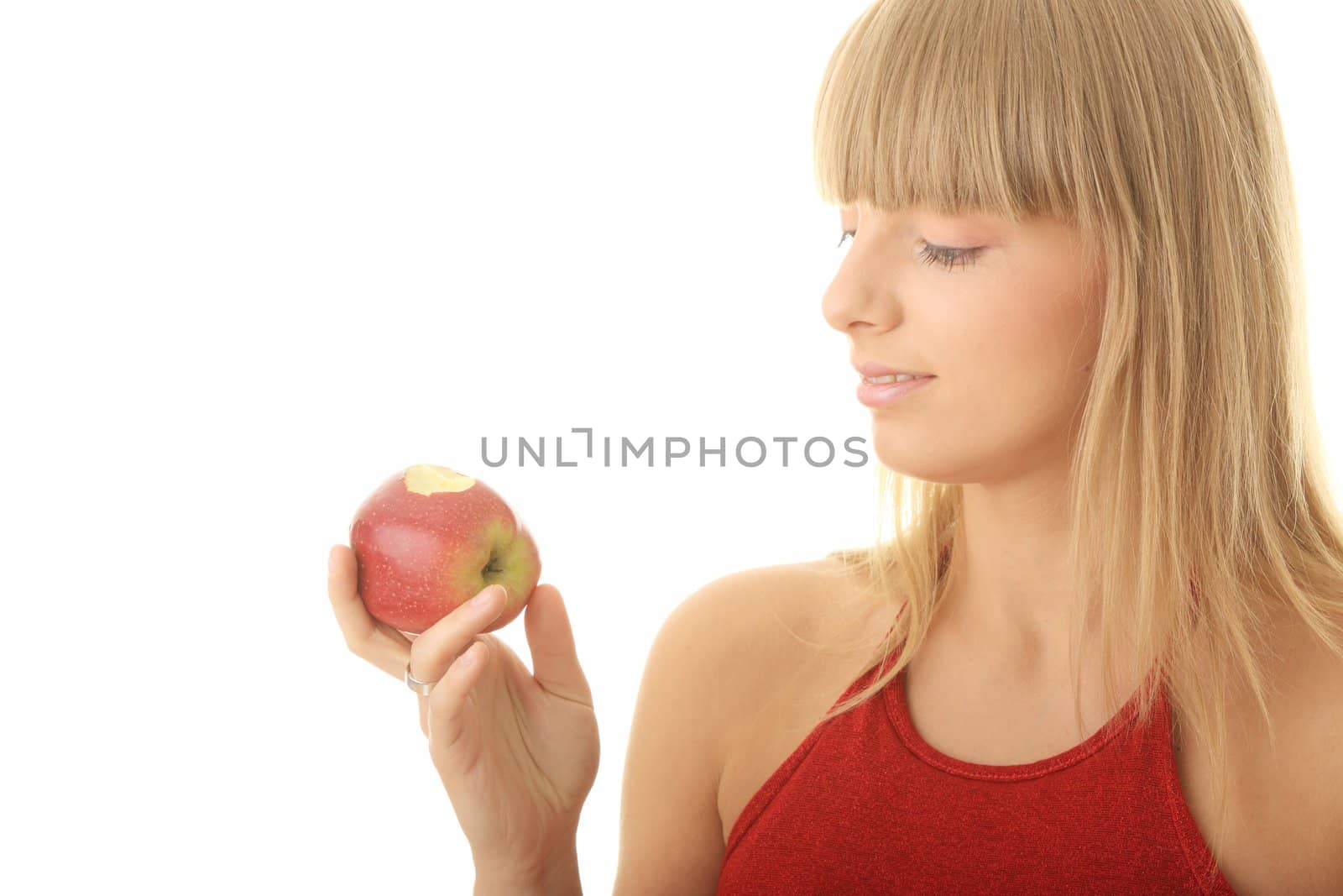 Young blond woman with red apple isolated on white background - healthy concept