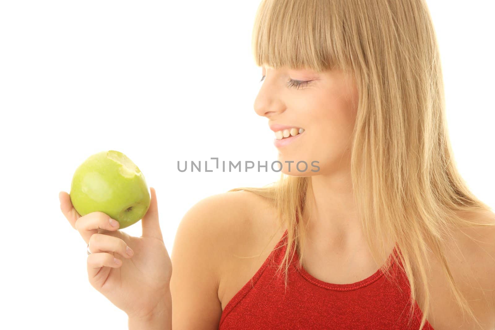 Young blond woman with green apple isolated on white background - healthy concept
