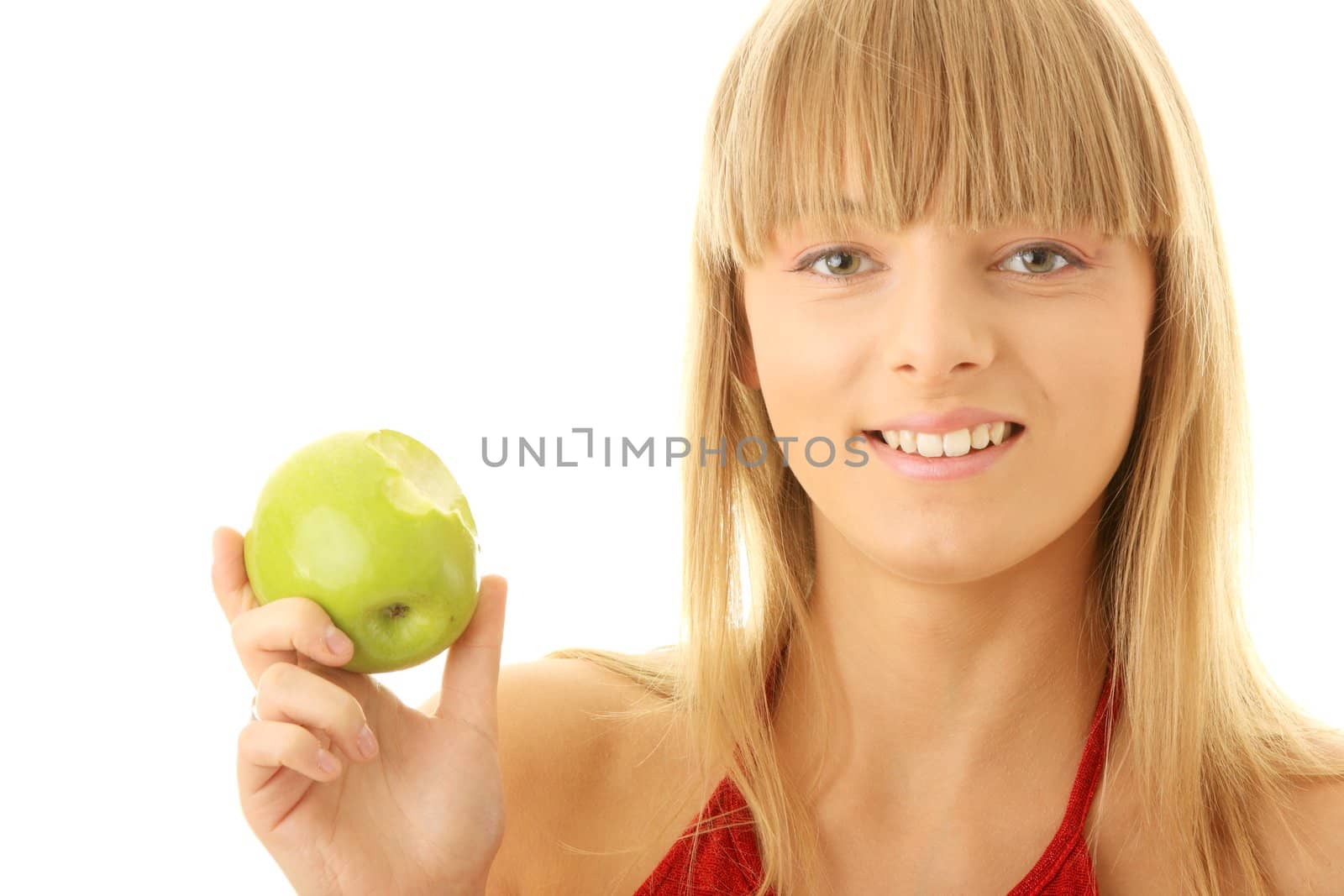 Young blond woman with green apple isolated on white background - healthy concept