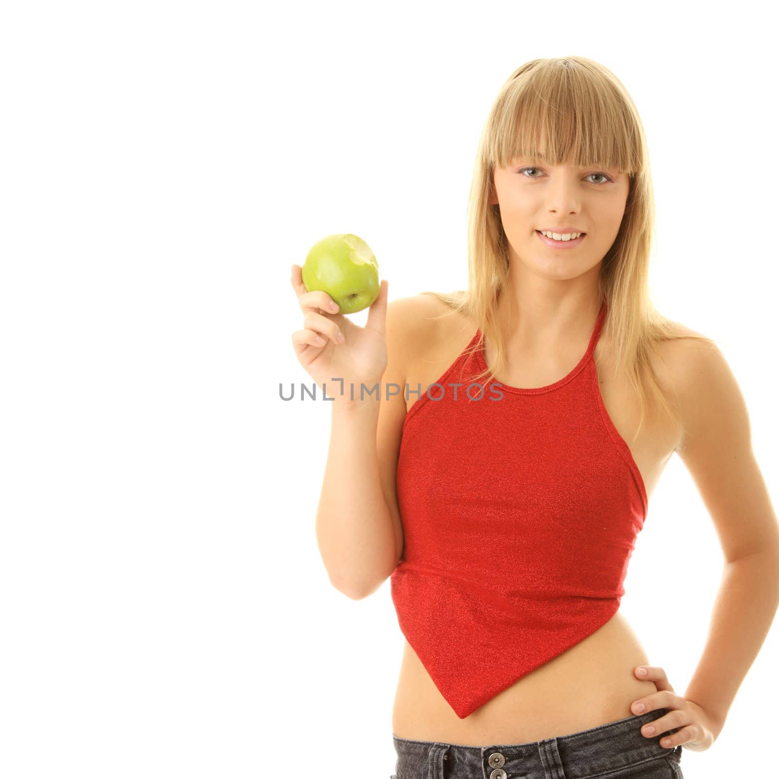 Young blond woman with green apple isolated on white background - healthy concept
