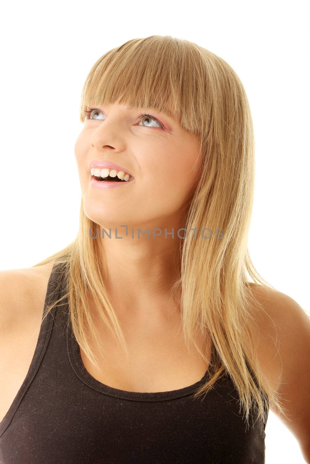 Portrait of young woman looking up left, isolated on white background