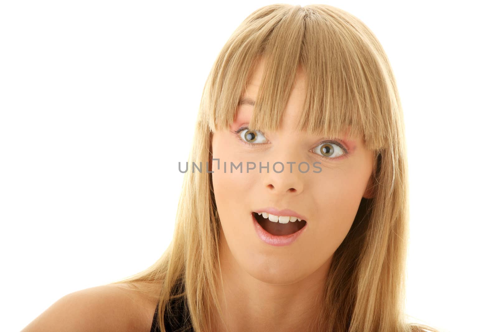 Face of a young shocked woman. Close up