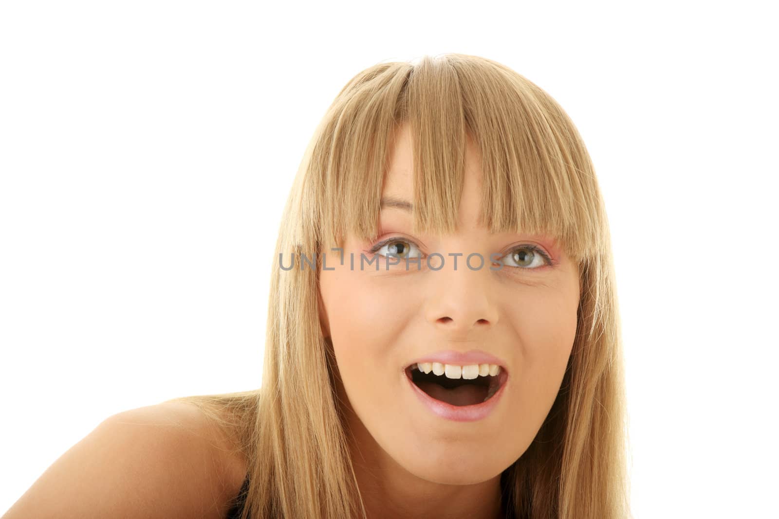 Face of a young shocked woman. Close up