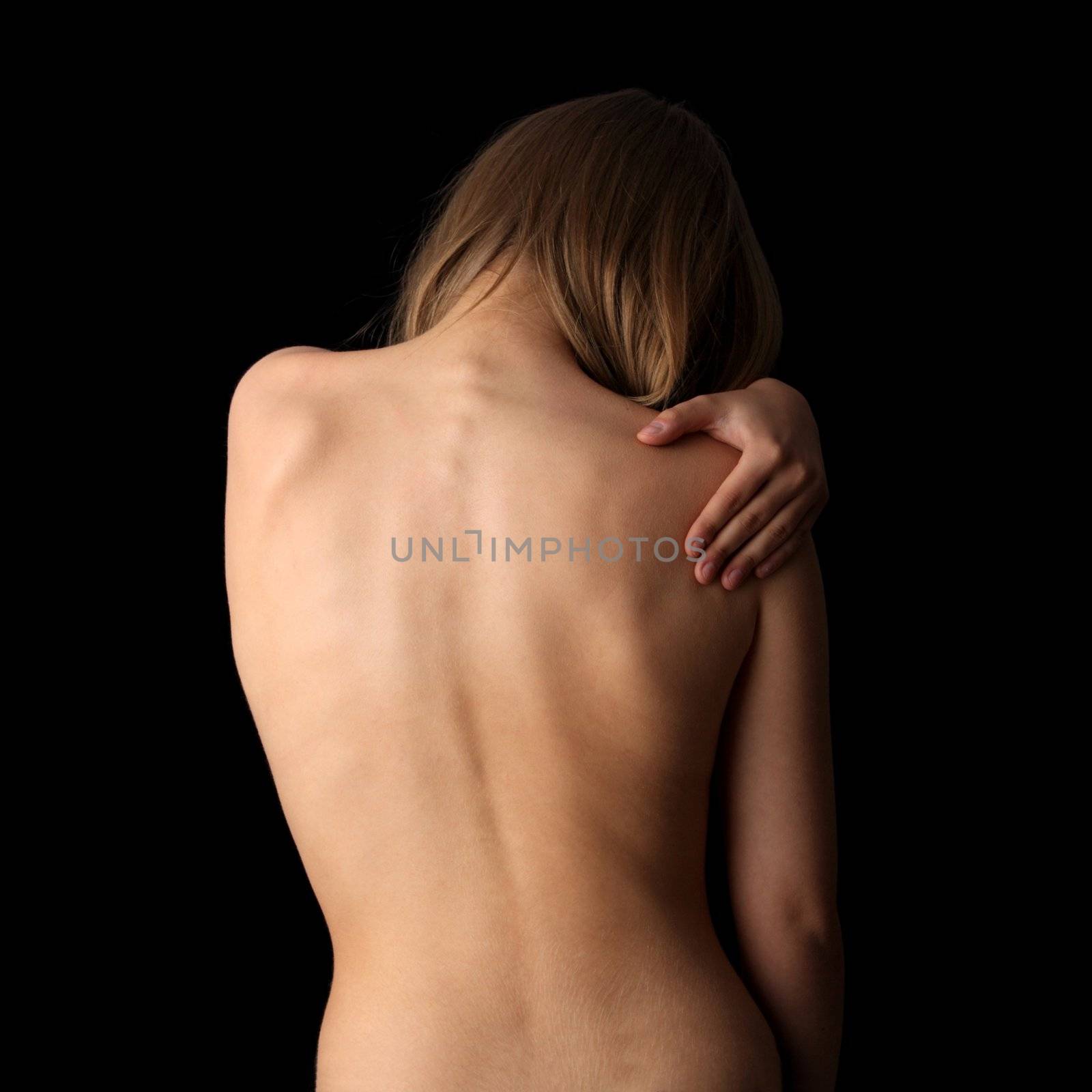 Woman from behind, naked body, pain concept