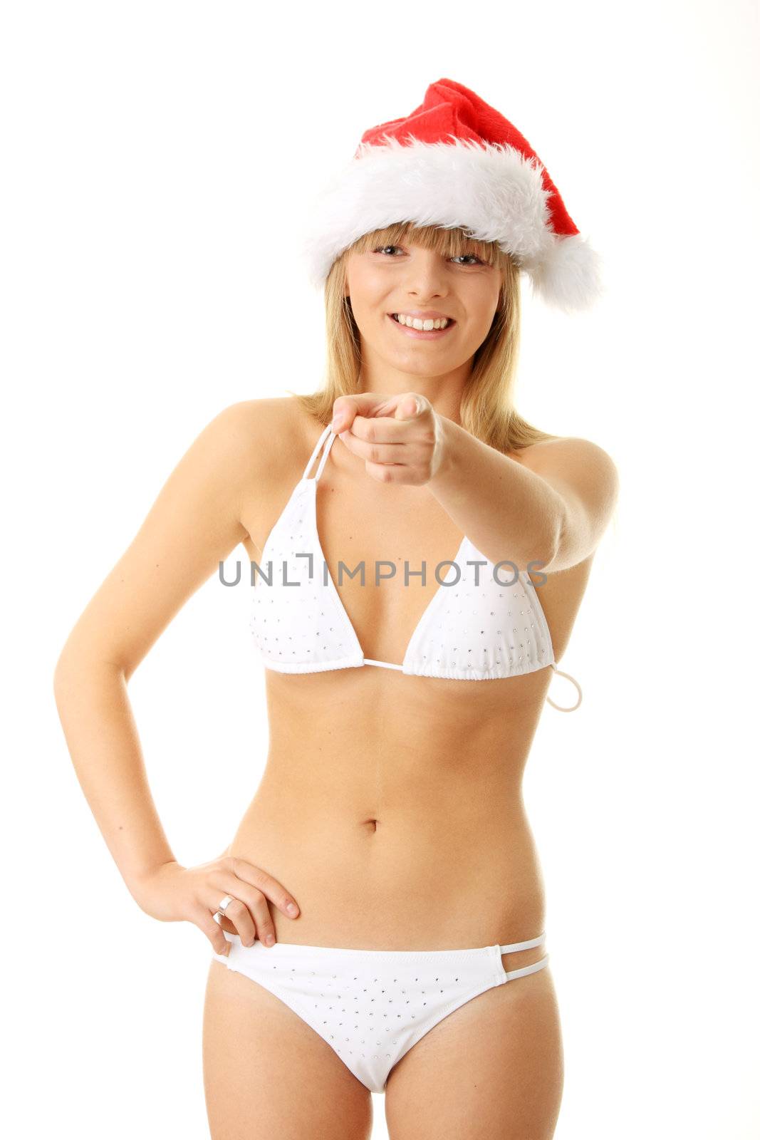 Sensual young woman wearing christmas hat. Isolated