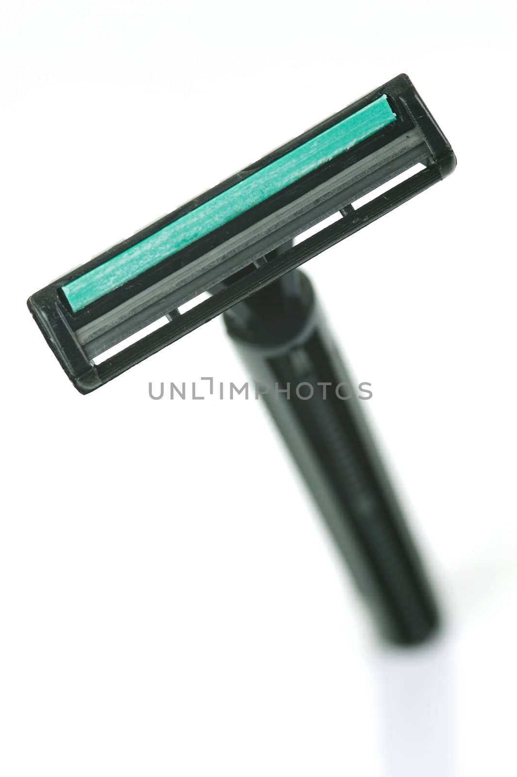A disposable razor isolated against a white background