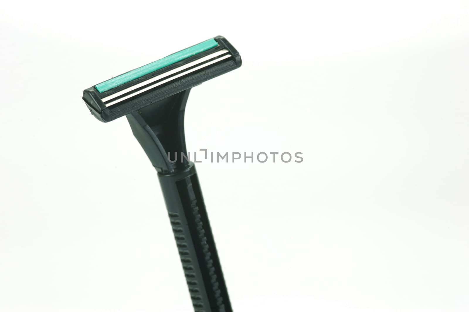 A disposable razor isolated against a white background