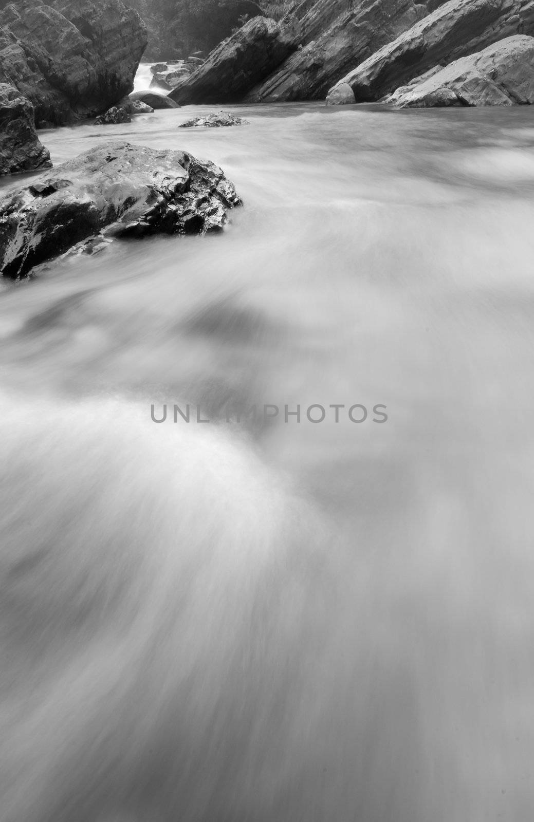 It is a beautiful river flow over the stone.