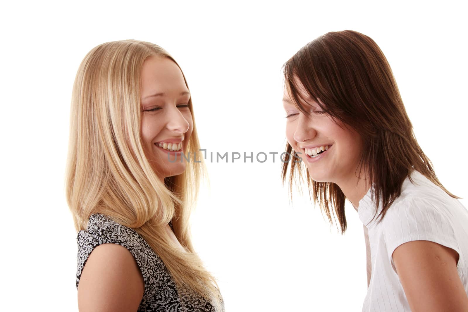 Happy young women friends laughing by BDS