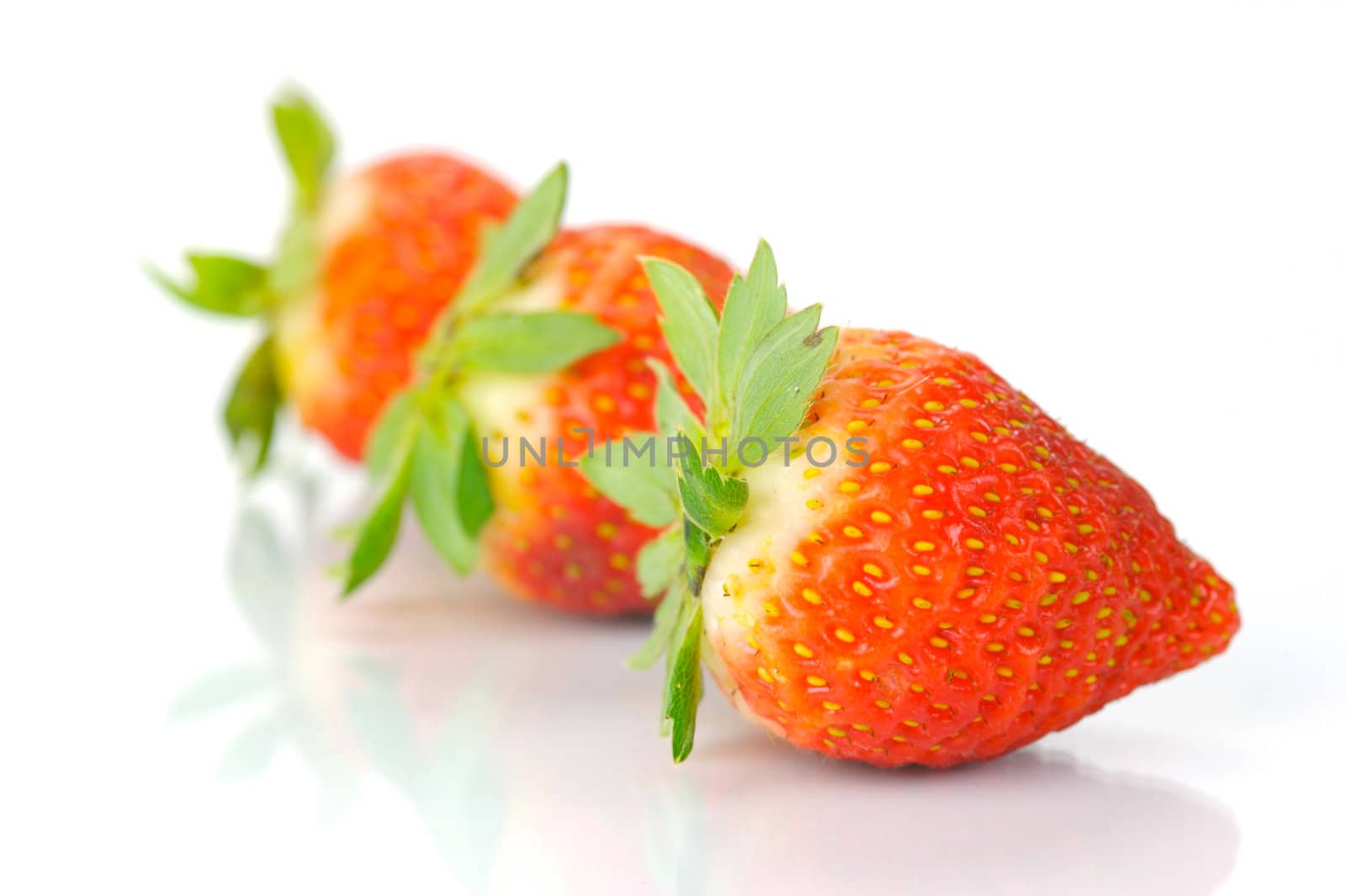 Fresh strawberries isolated against a white background