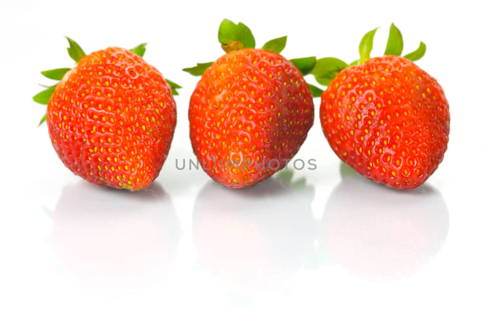 Fresh strawberries isolated against a white background