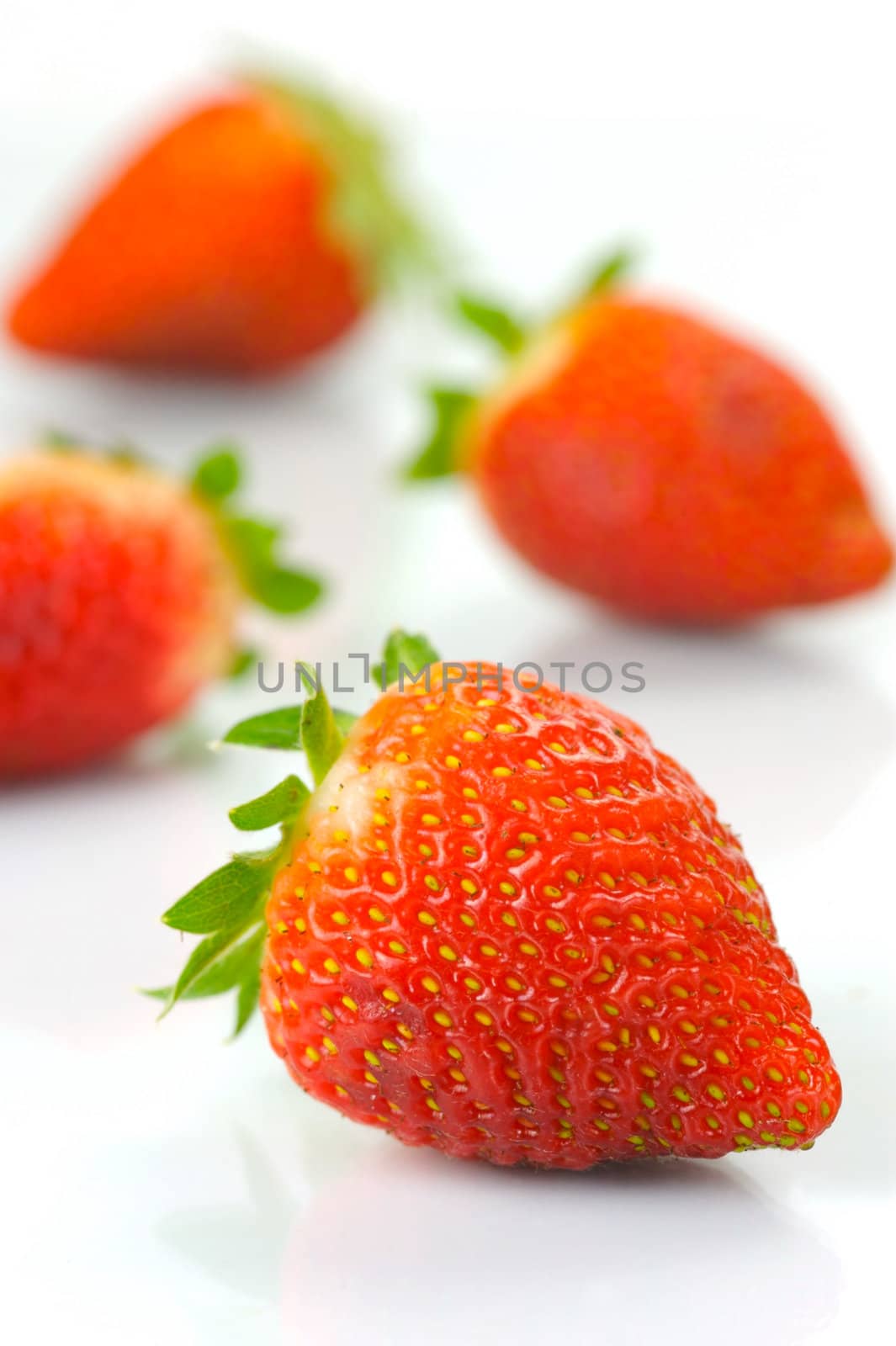 Fresh strawberries isolated against a white background