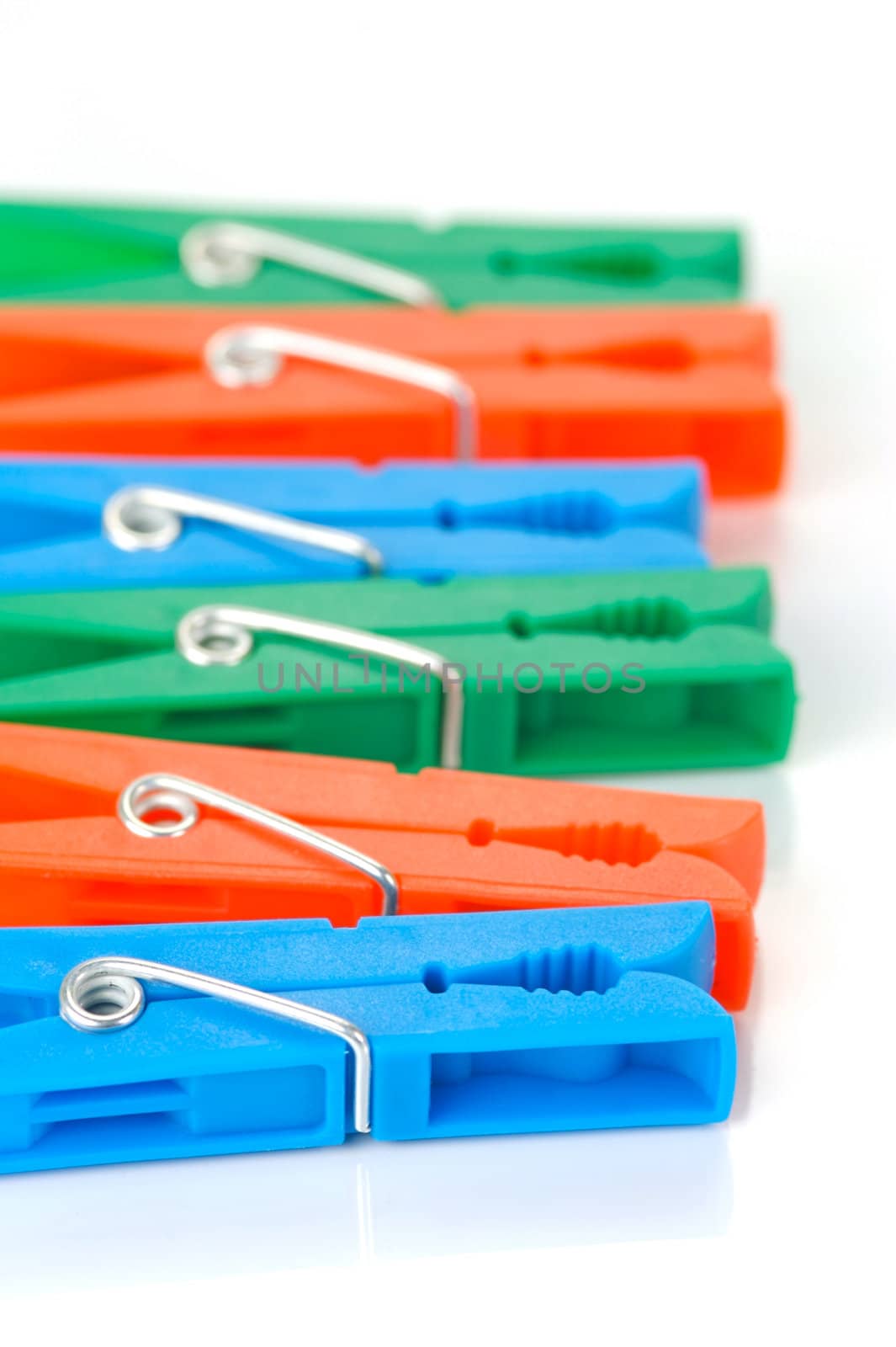 Clothes line pegs isolated against a white background