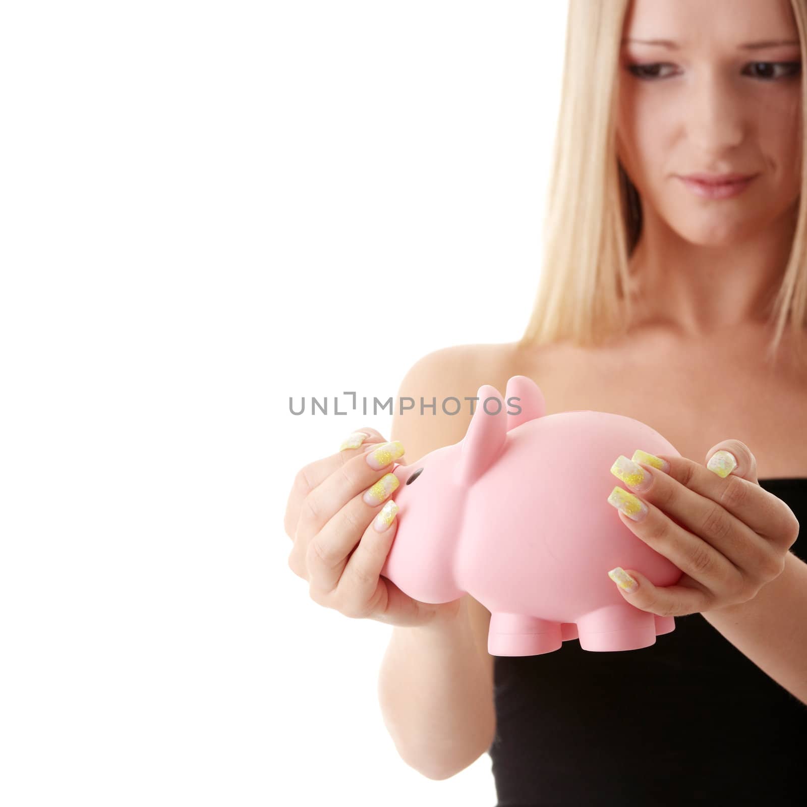 Young casual caucasian woman holding piggy-bank isolated on white background