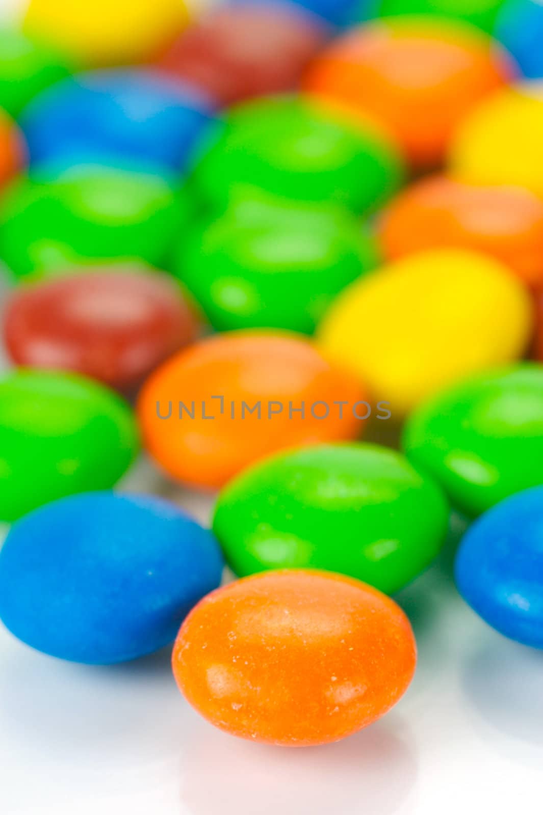 Chocolate coated candy isolated against a white background