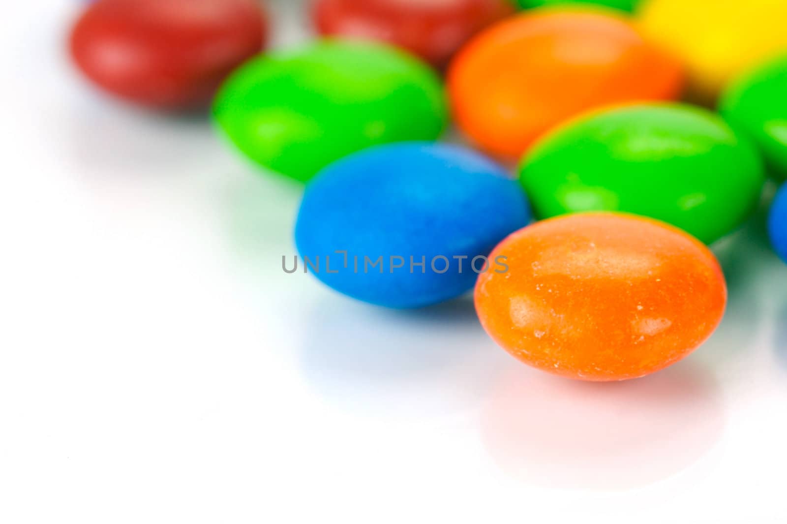 Chocolate coated candy isolated against a white background