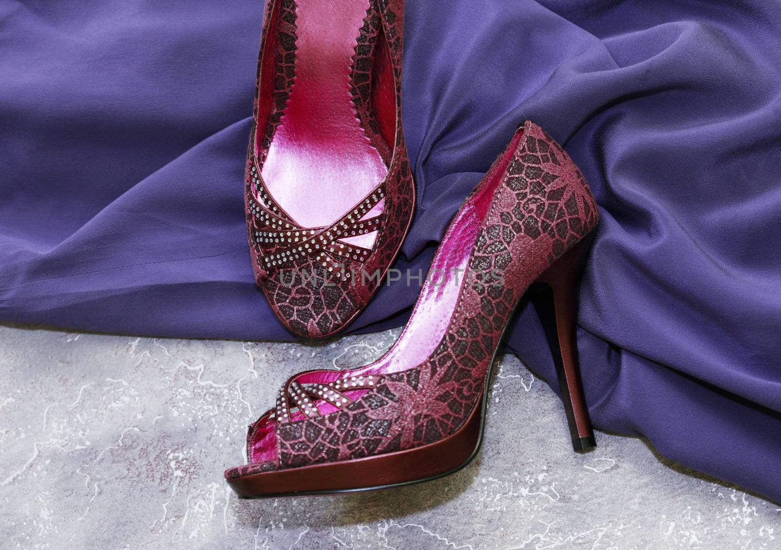 Female shoes and violet silk dress