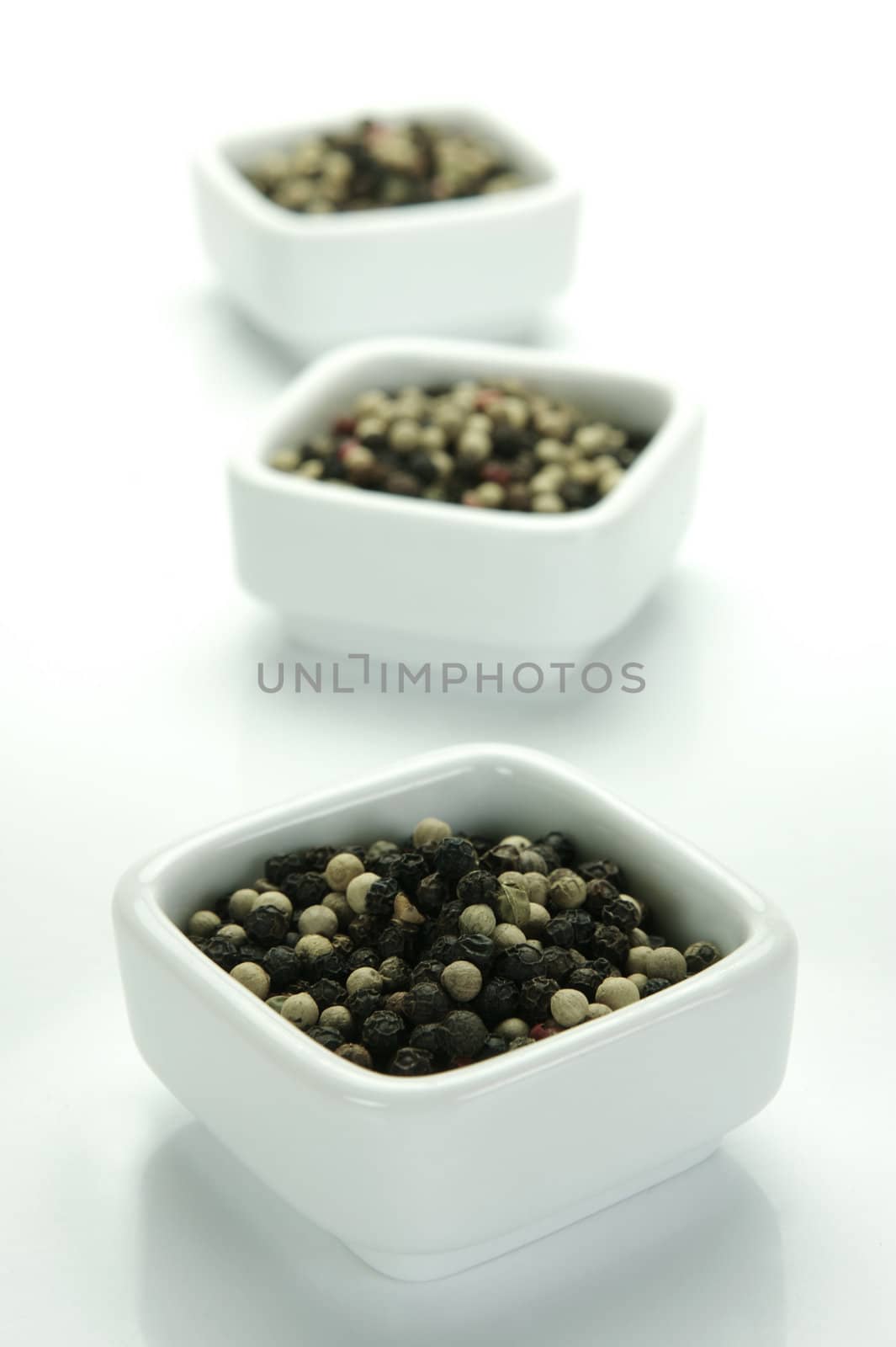 A close up shot of mixed pepper corns mixed together