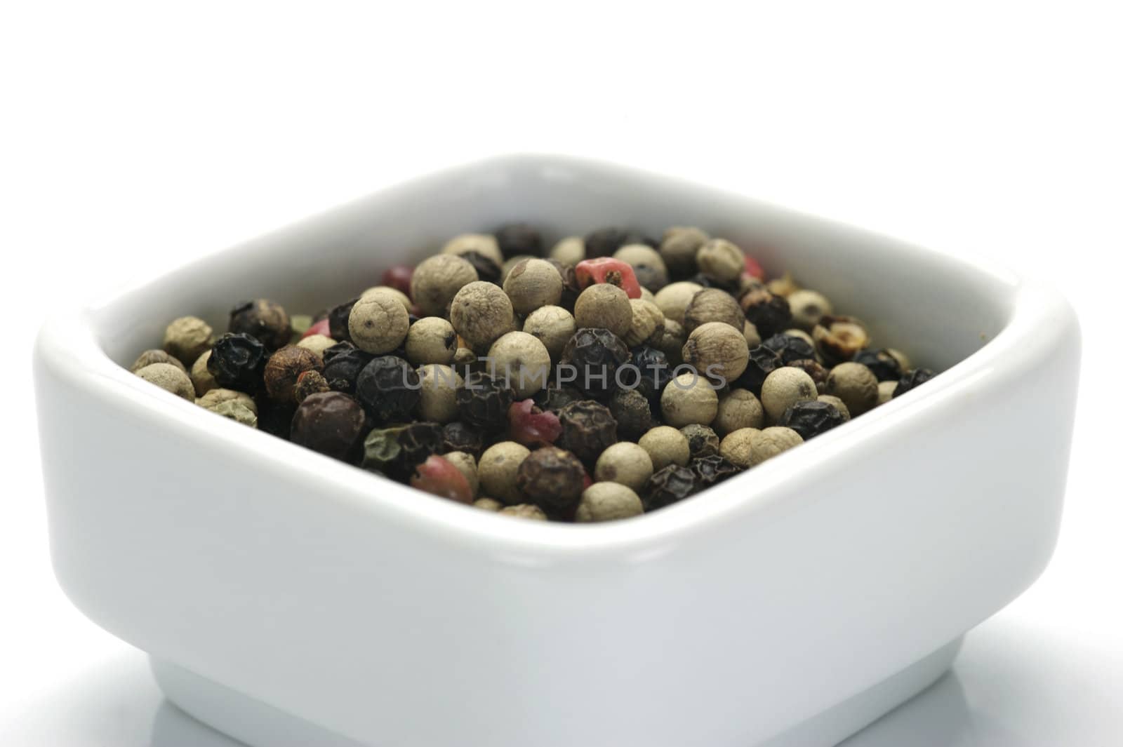 A close up shot of mixed pepper corns mixed together