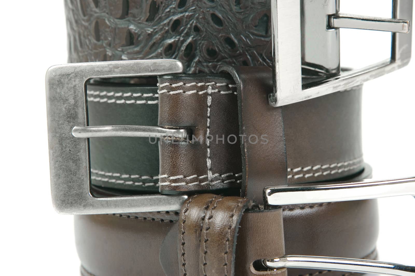 Brown belts isolated against a white background
