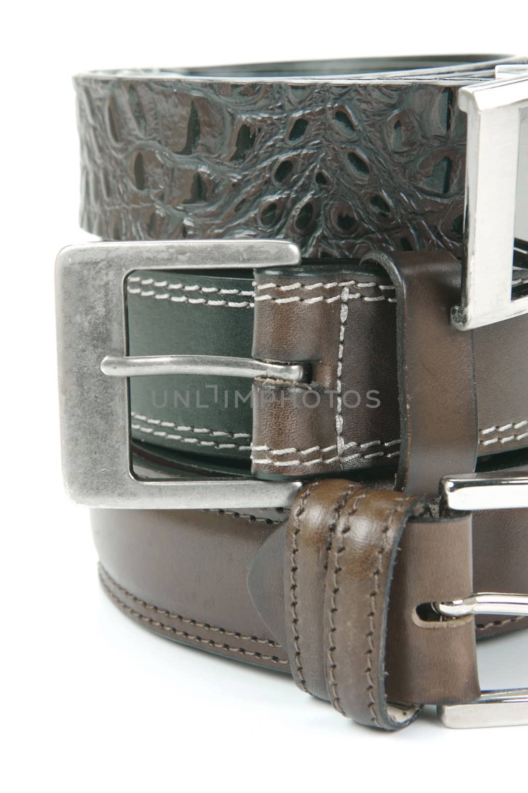 Brown belts isolated against a white background