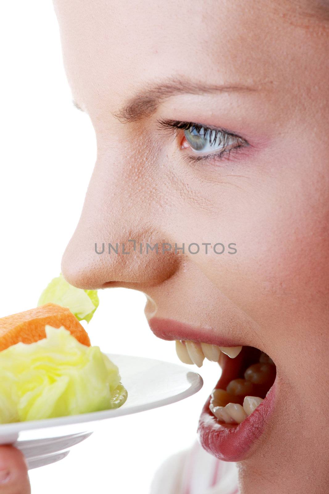 Female eating her salad isolated on white background