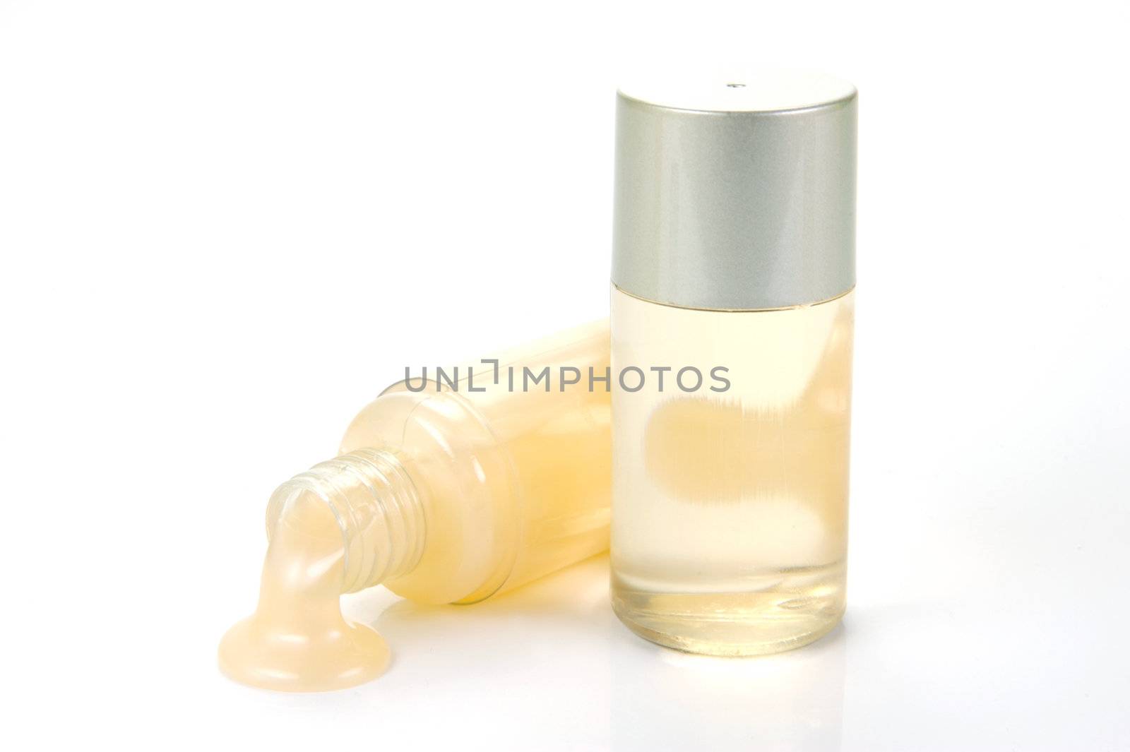 Miniatureshampoo bottles isolated against a white background