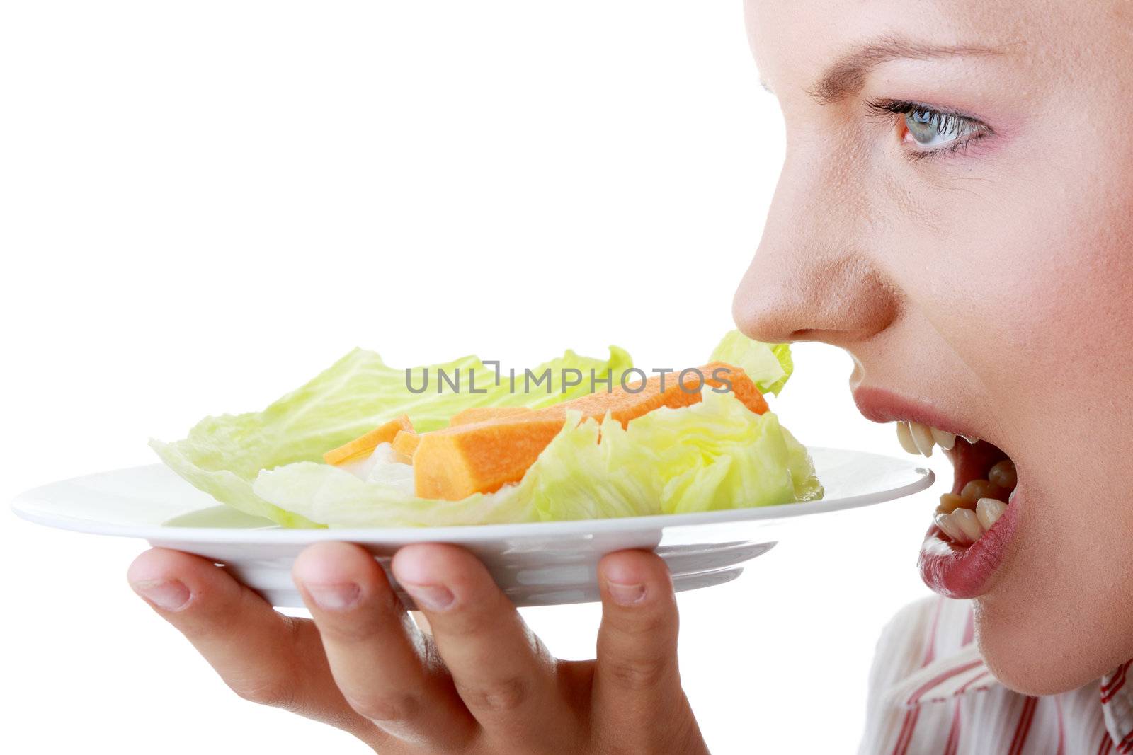 Female eating her salad isolated on white background