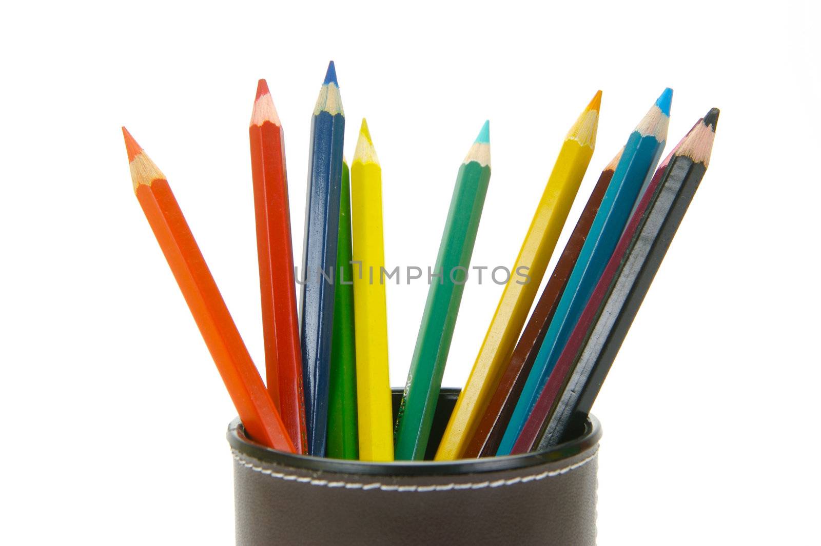 Colored Pencils in a cup holder isolated against a white background