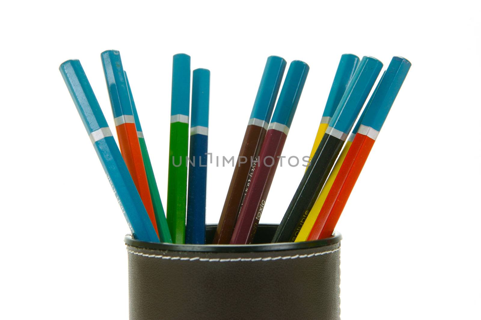 Colored Pencils in a cup holder isolated against a white background