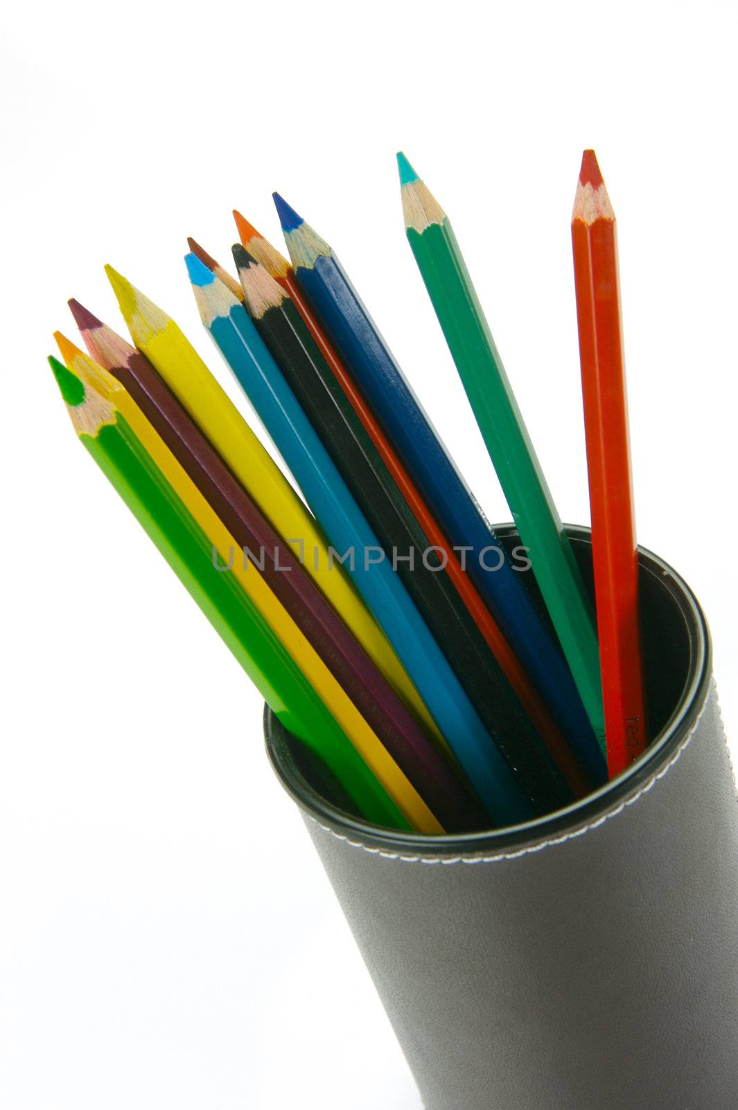 Colored Pencils in a cup holder isolated against a white background