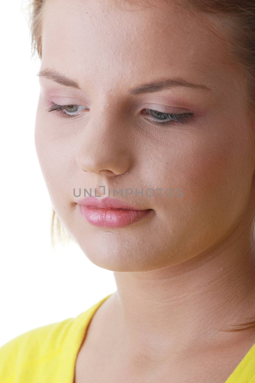 Closeup portrait of a sad young woman isolated on white
