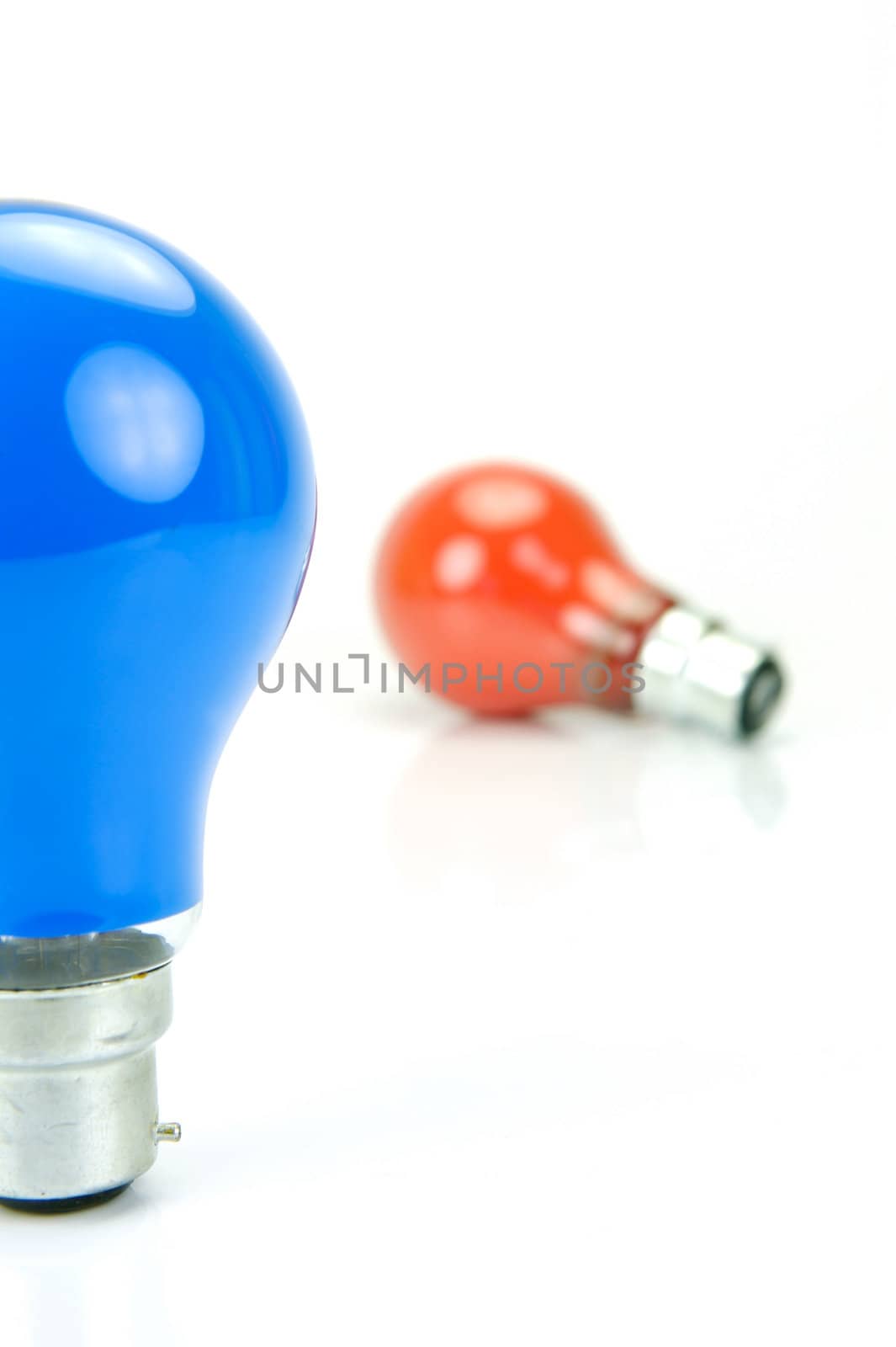 Colored light bulbs isolated against a white background