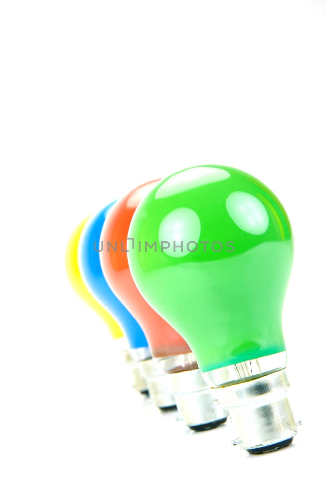 Colored light bulbs isolated against a white background