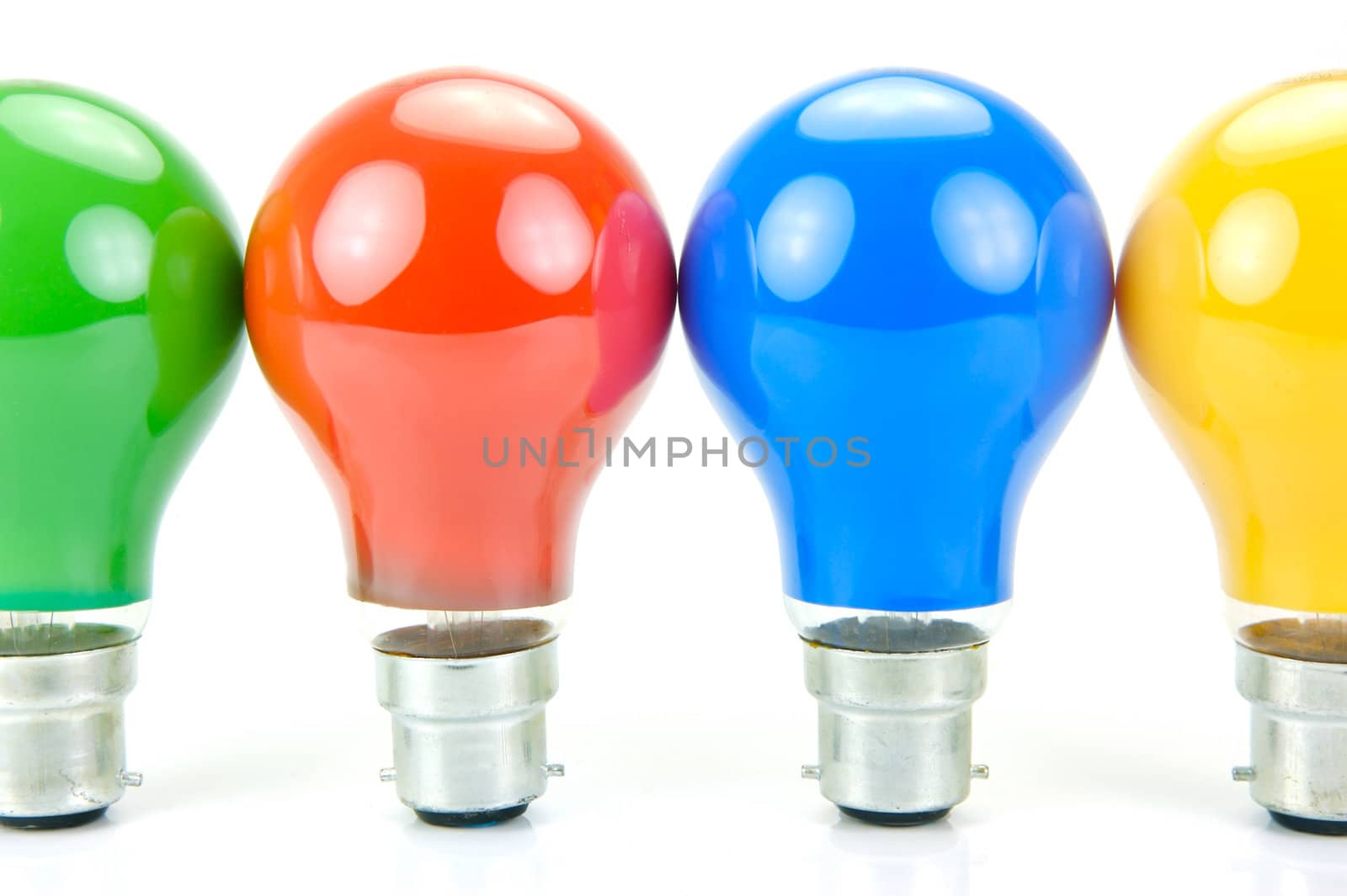 Colored light bulbs isolated against a white background