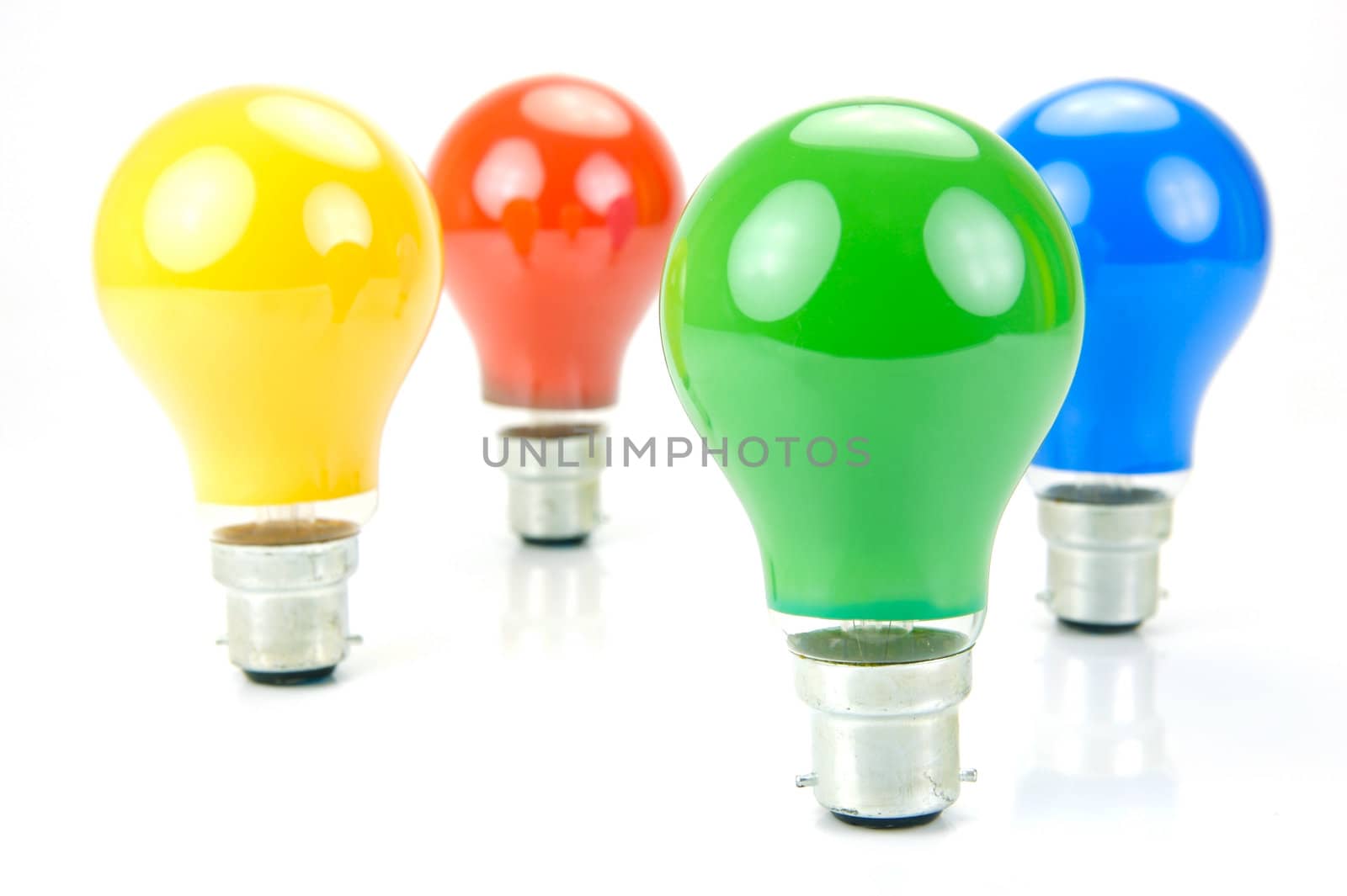 Colored light bulbs isolated against a white background