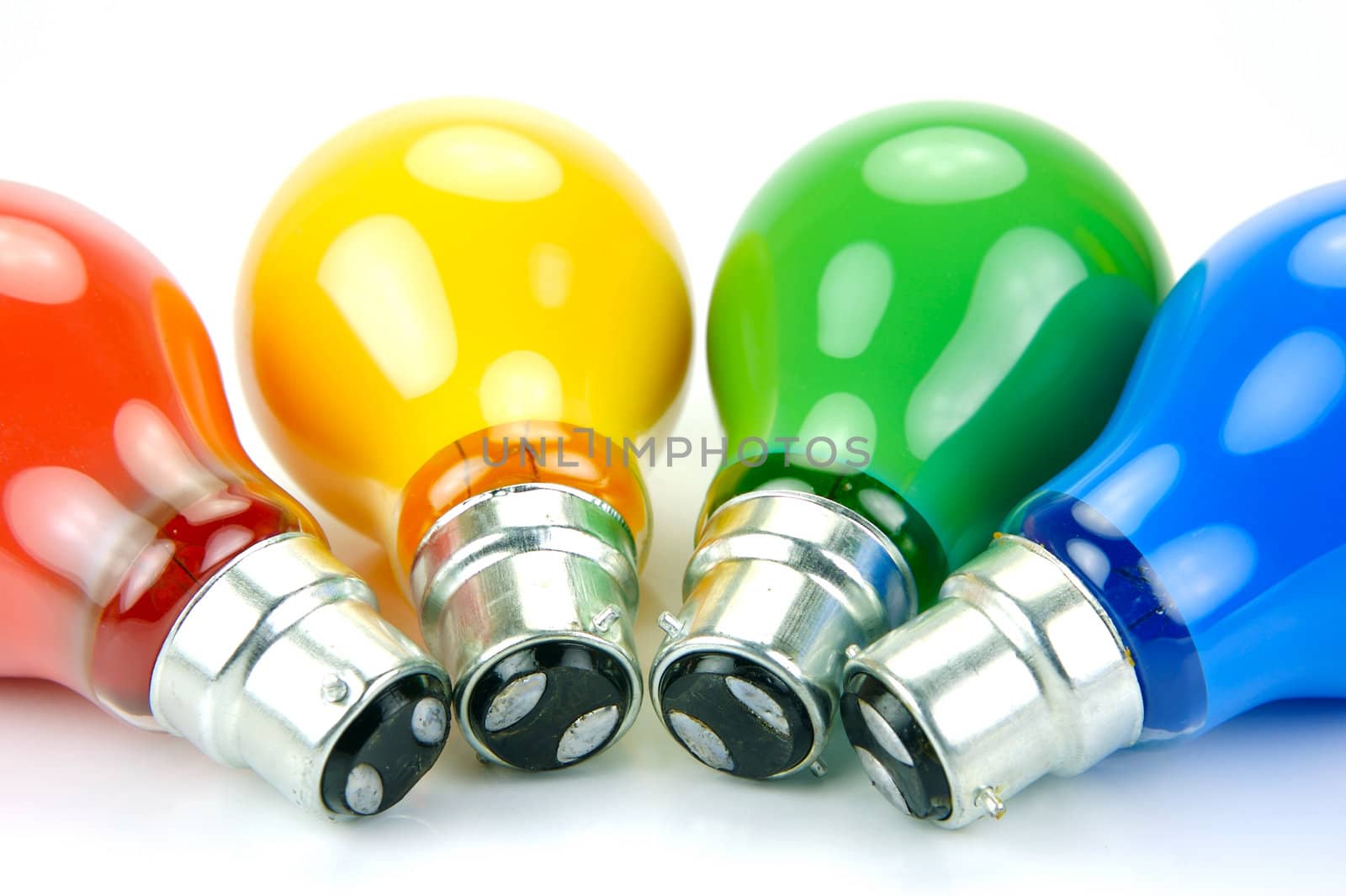 Colored light bulbs isolated against a white background