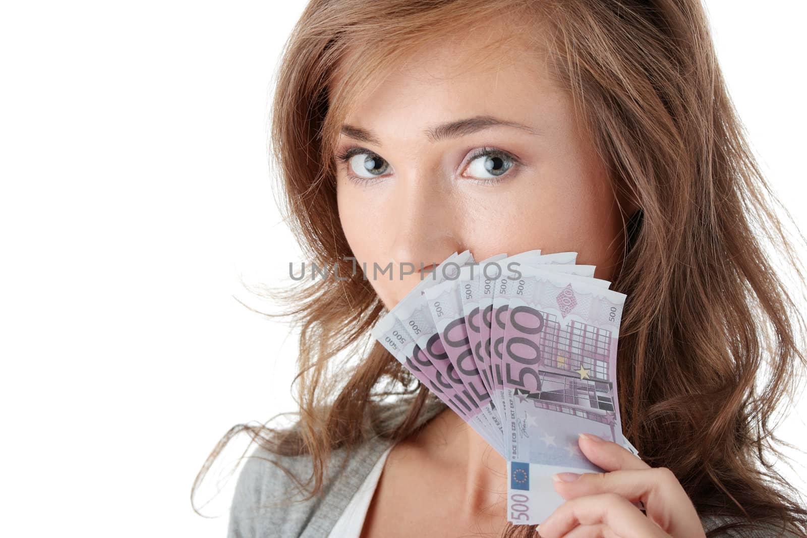 Happy young woman holding money isolated on white