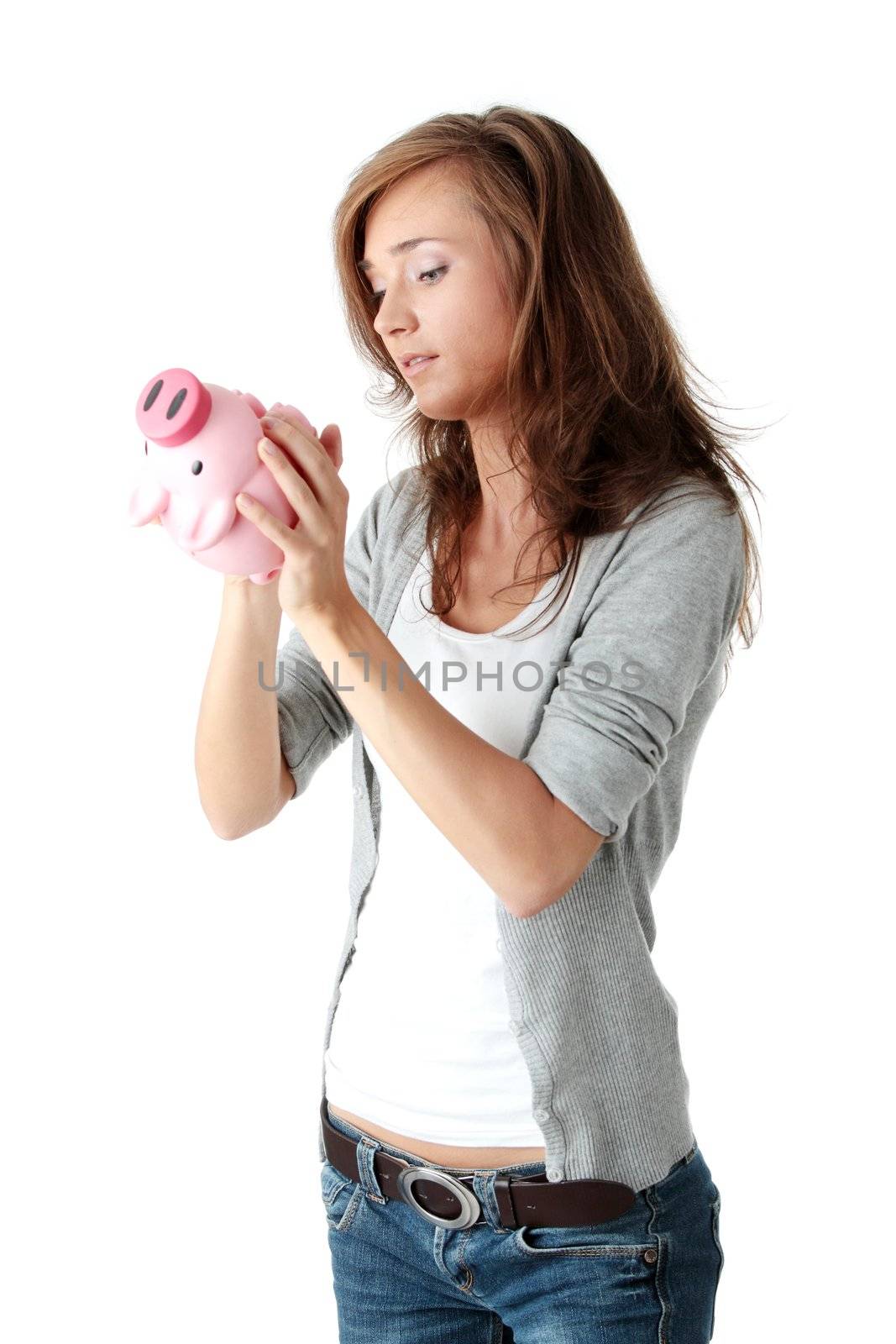 Young beautiful woman standing with piggy bank (money box), isolated on white background