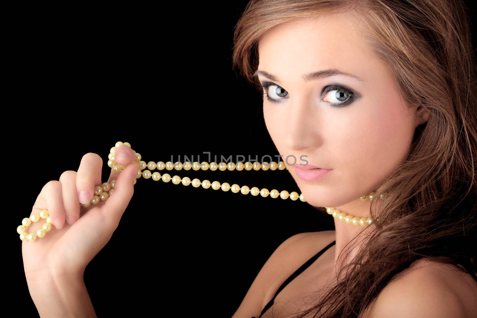 The dreaming woman with a pearl necklace