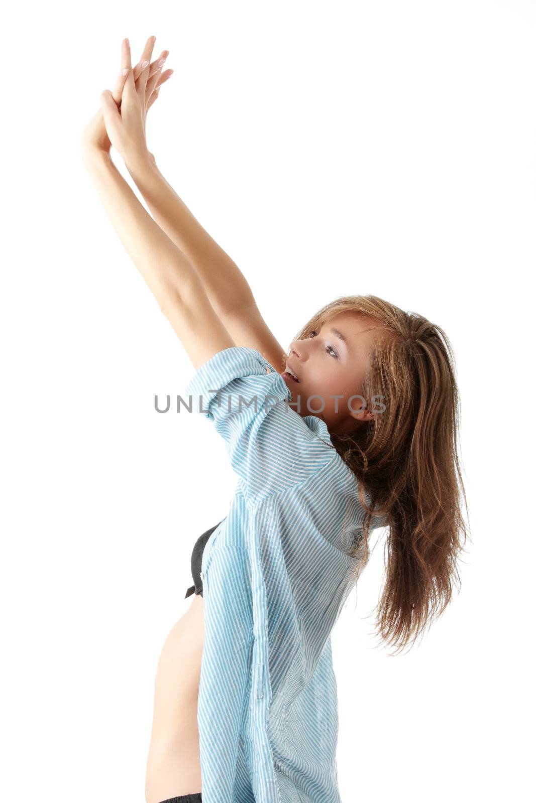 Young beautiful morning woman in big shirt and underwear stretching