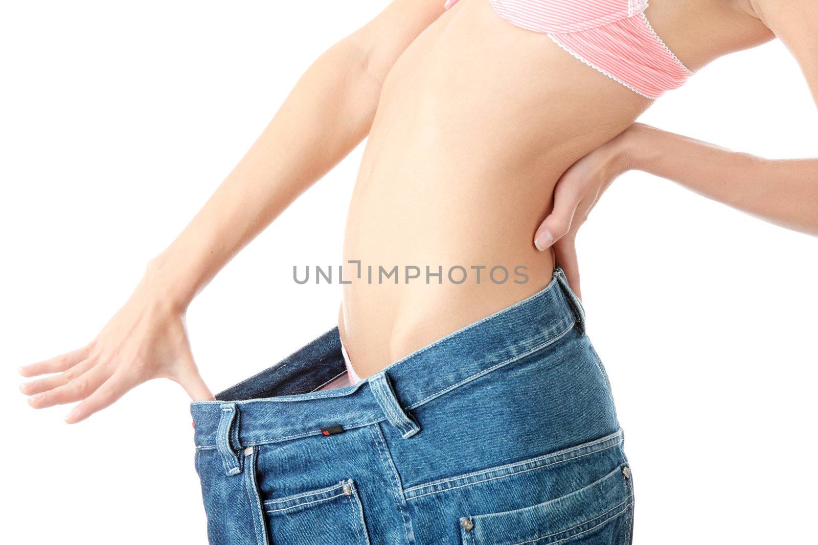 Woman showing how much weight she lost. Isolated