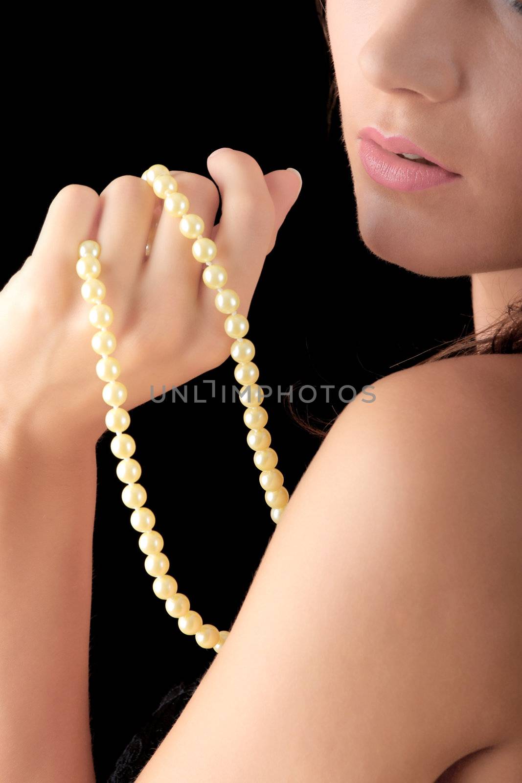 The dreaming woman with a pearl necklace