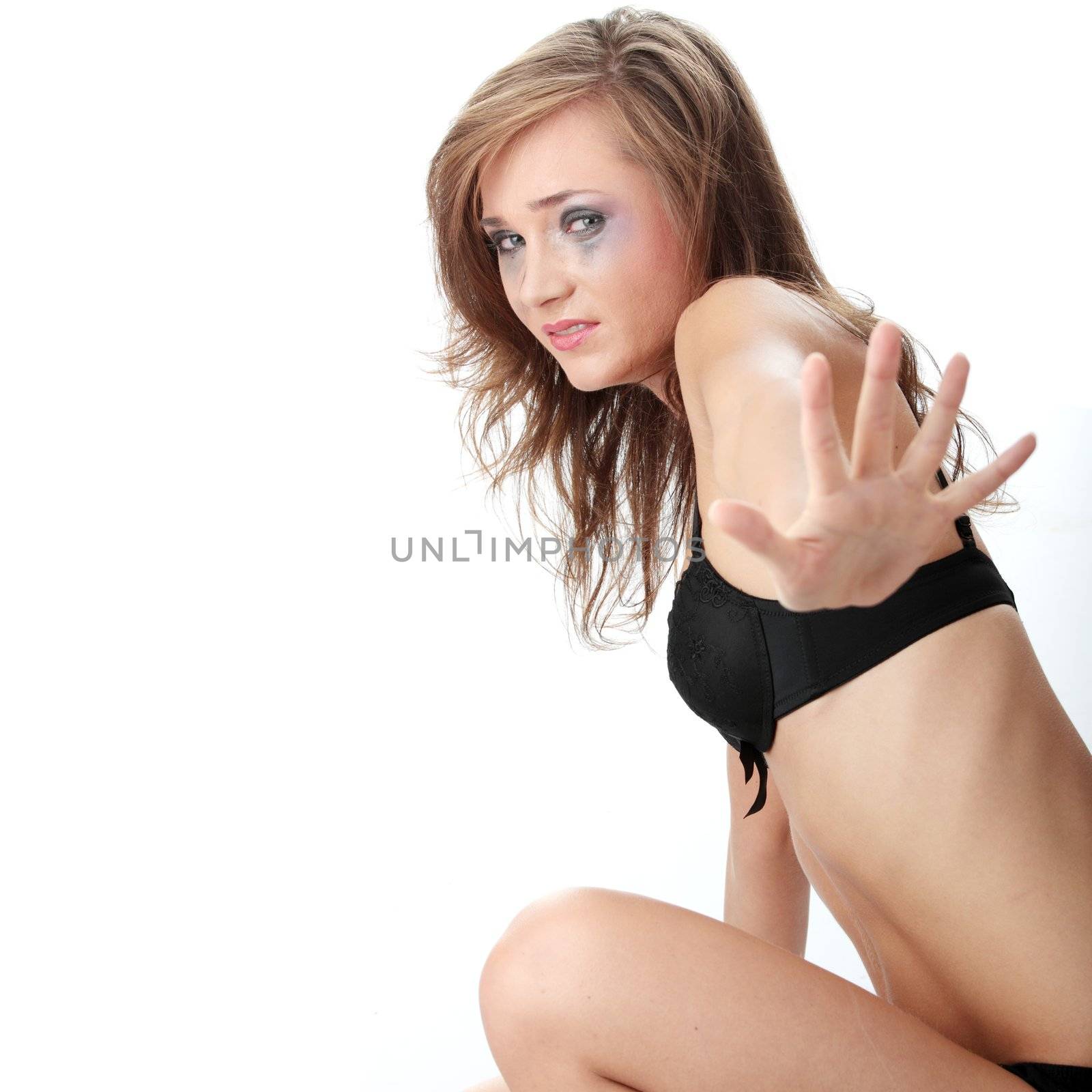 Emotional portrait of abused, crying, beautiful, young ,caucasian woman in underwear - violence concept