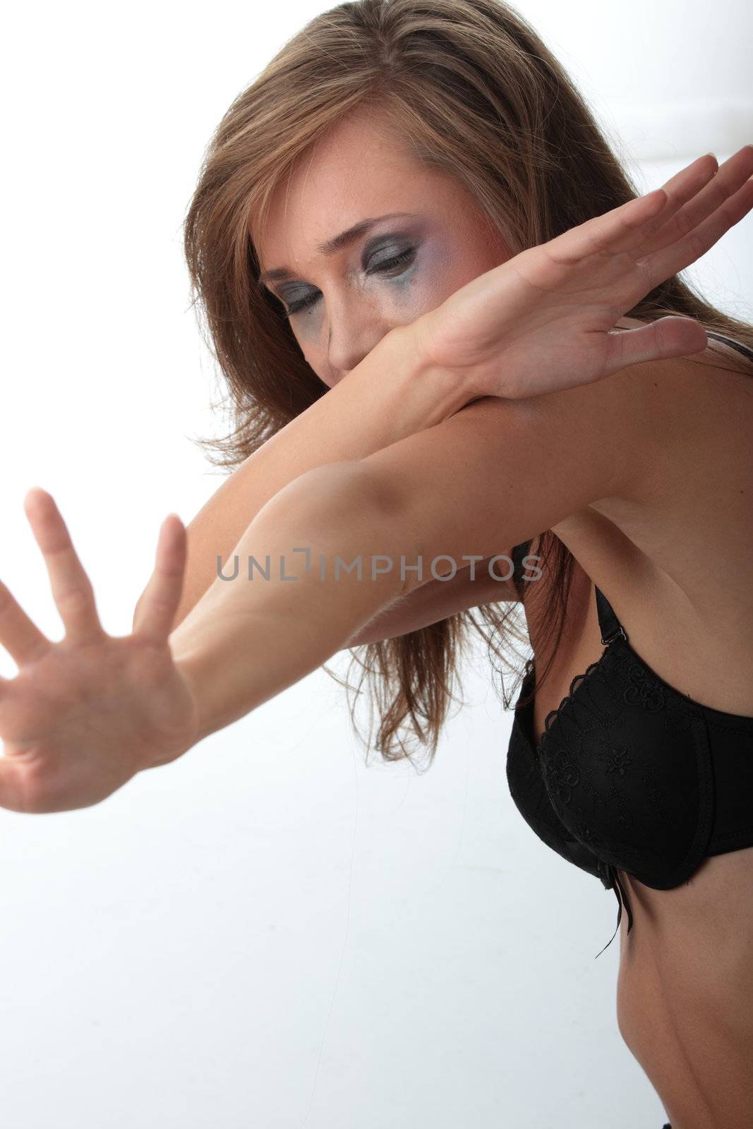 Emotional portrait of abused, crying, beautiful, young ,caucasian woman in underwear - violence concept