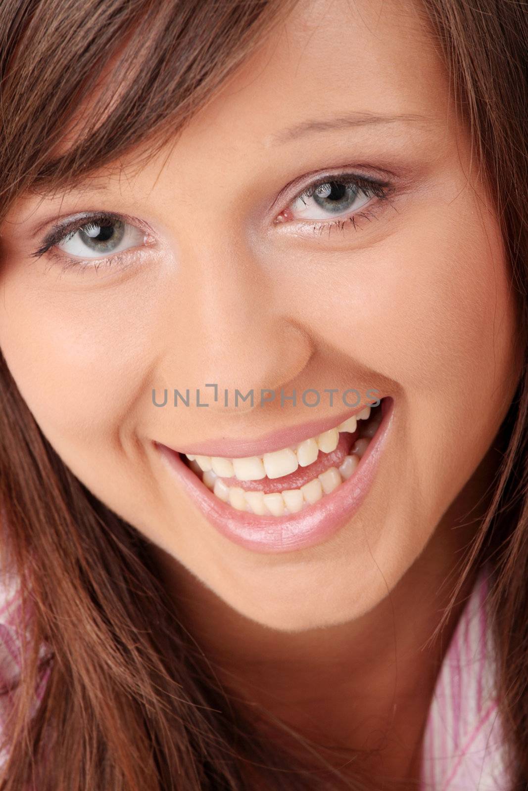 Happy and friendly young lady posing isolated on white background