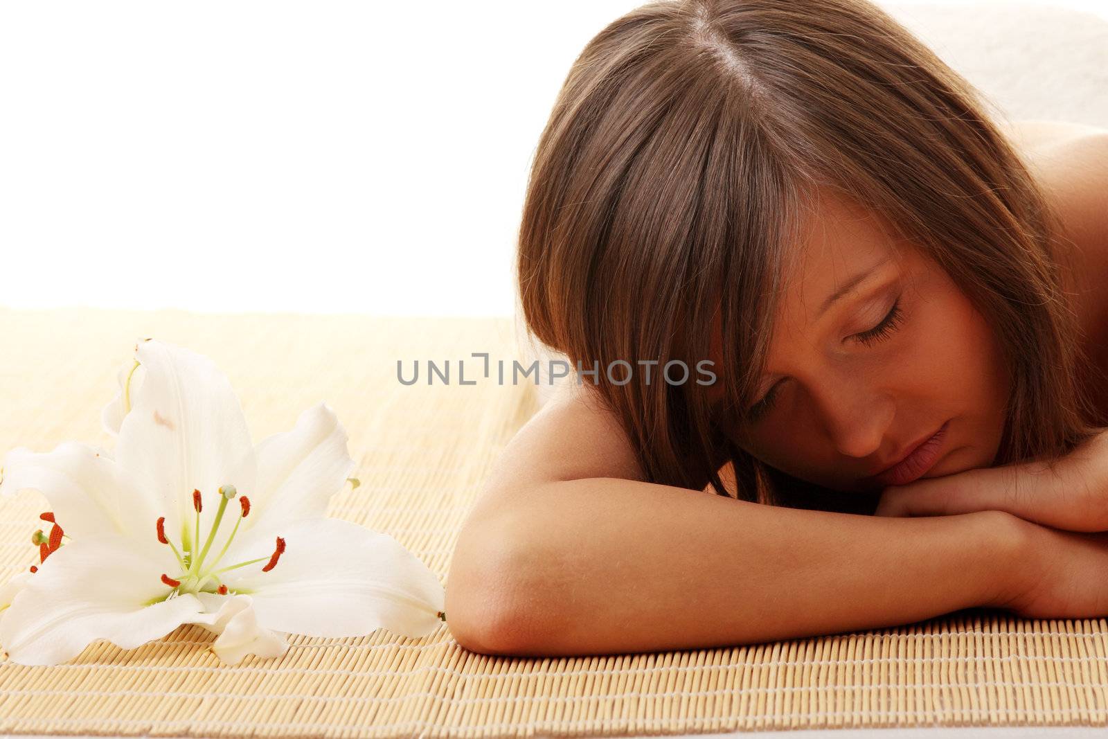 Young woman (teen girl) relaxing in massage